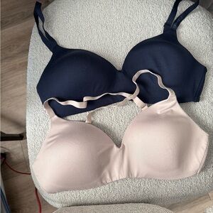 Calvin Kline wire free bras . New without tags . One navy-blue one grey-beige .